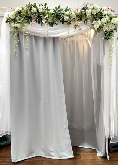 white photo booth flowers